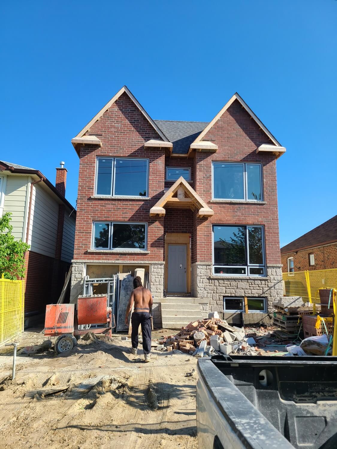 New custom home with brick veneer and a stone base, laid by All Canadian Masonry