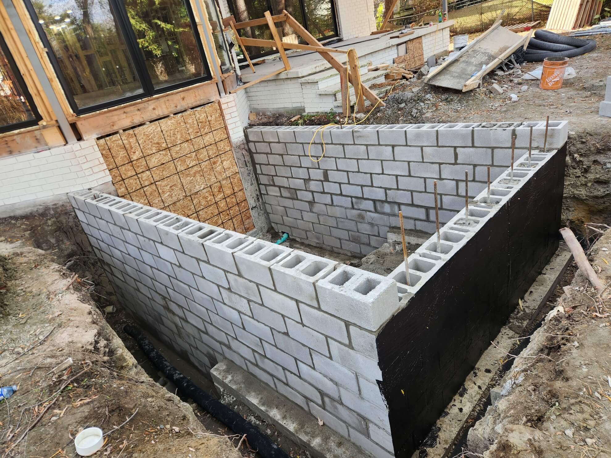 New concrete block foundation walls for a home addition
